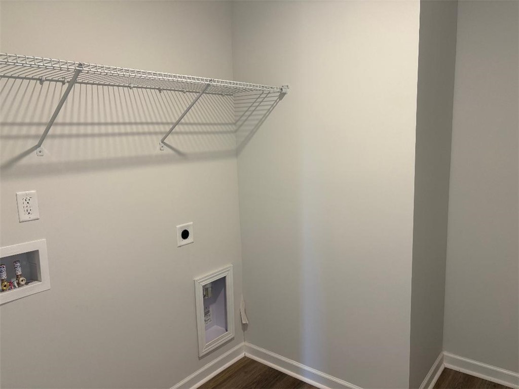 129 Cedar Shoals Easley, SC 29640 - Photo 24 of 31 Functional utility space with durable flooring and convenient wall shelving.