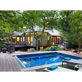 a swimming pool view with a outdoor seating space