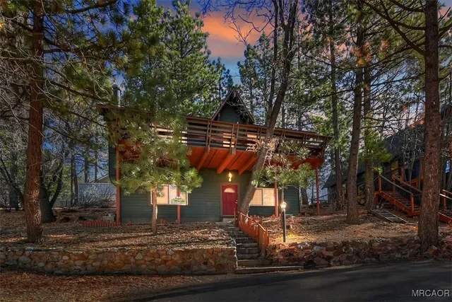 a view of a trees in front of a house