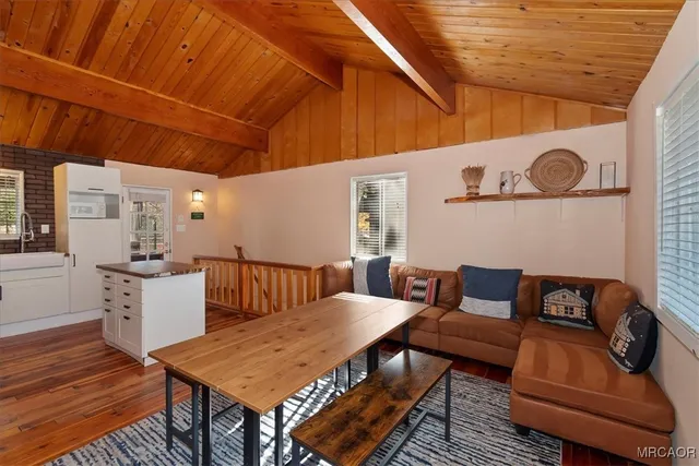 a outdoor living space with furniture and wooden floor