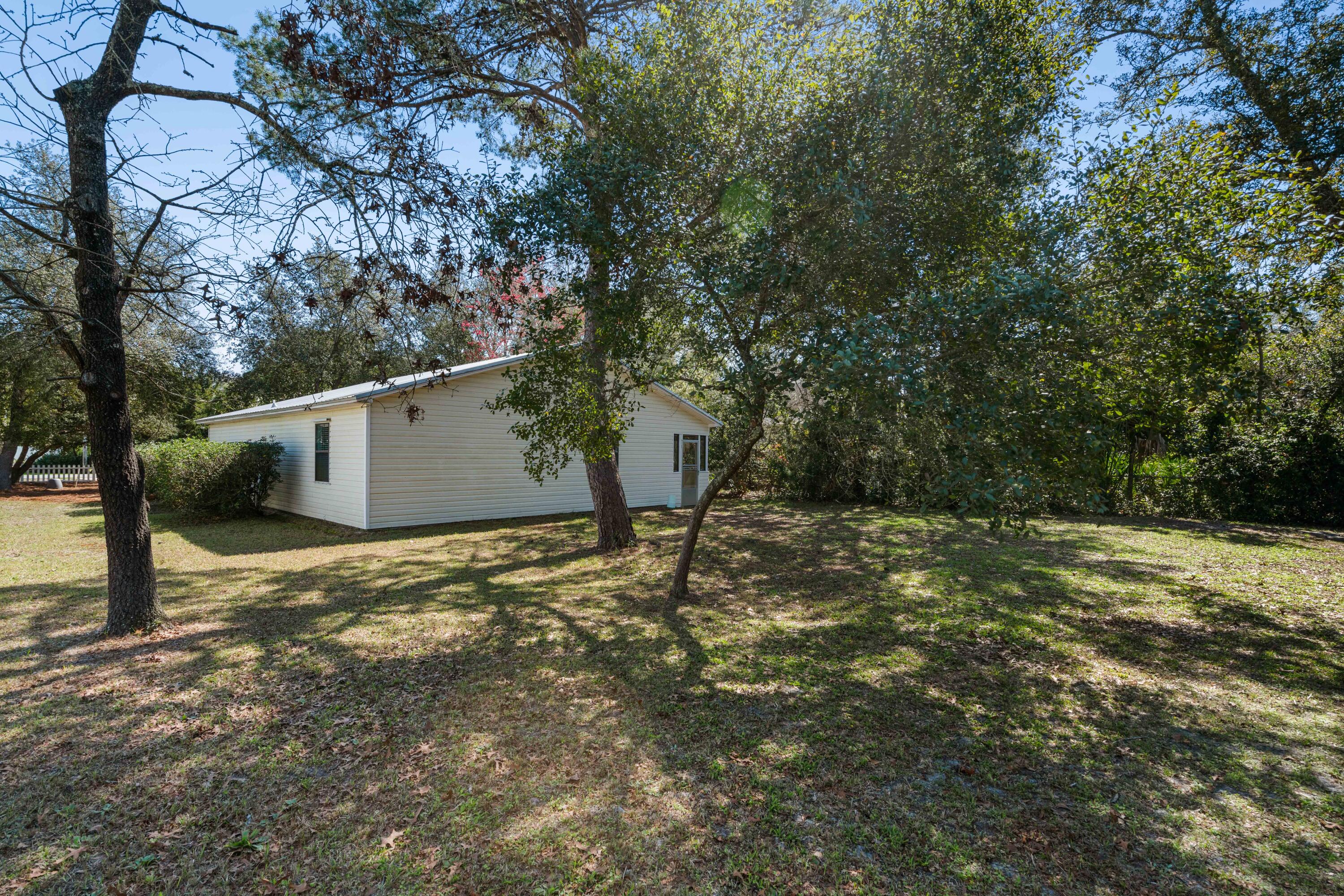 465 Seacrest Drive Inlet Beach, FL 32461 - Photo 11 of 47 a backyard of a house