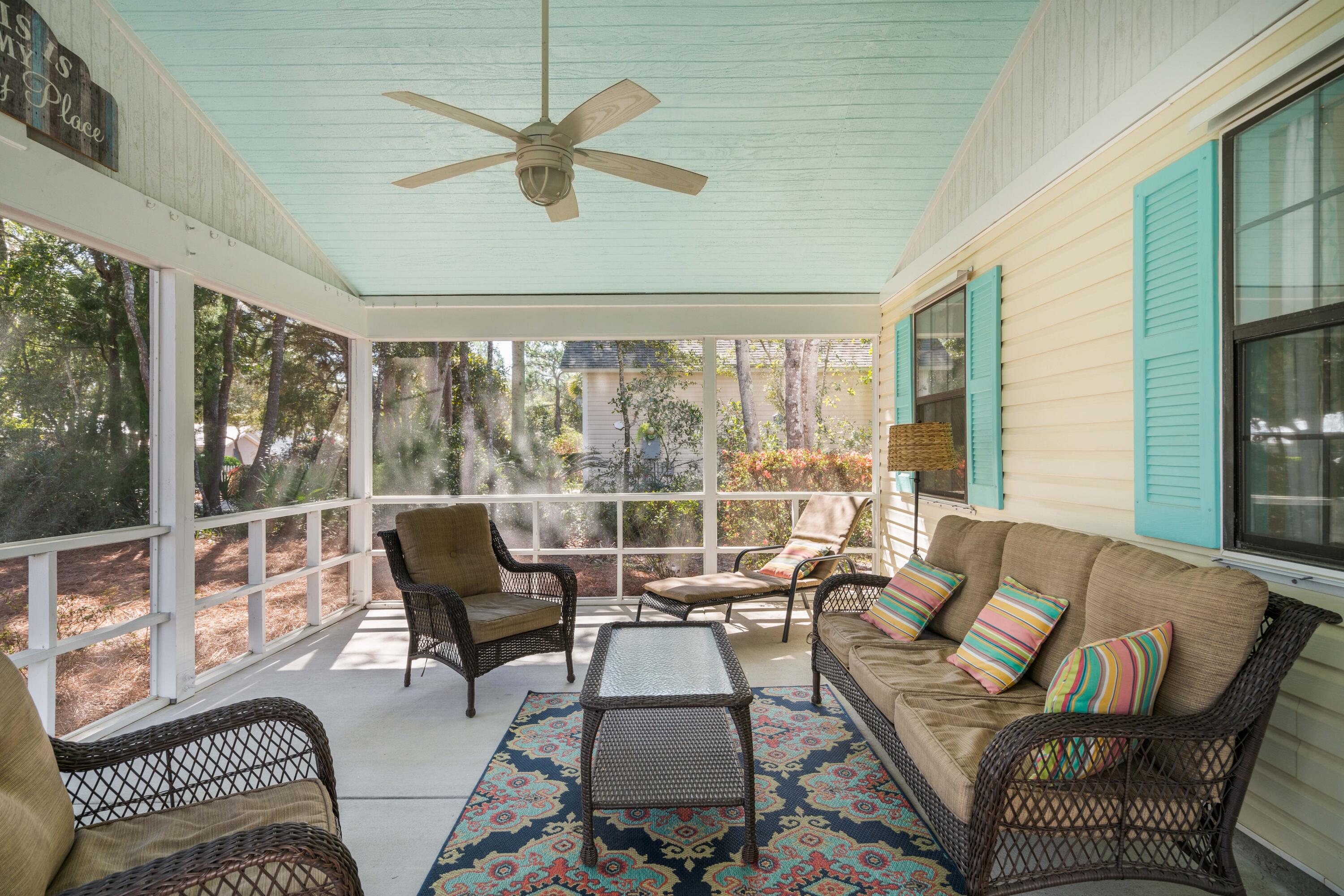 465 Seacrest Drive Inlet Beach, FL 32461 - Photo 14 of 47 a living room with furniture and a large window with wooden floor