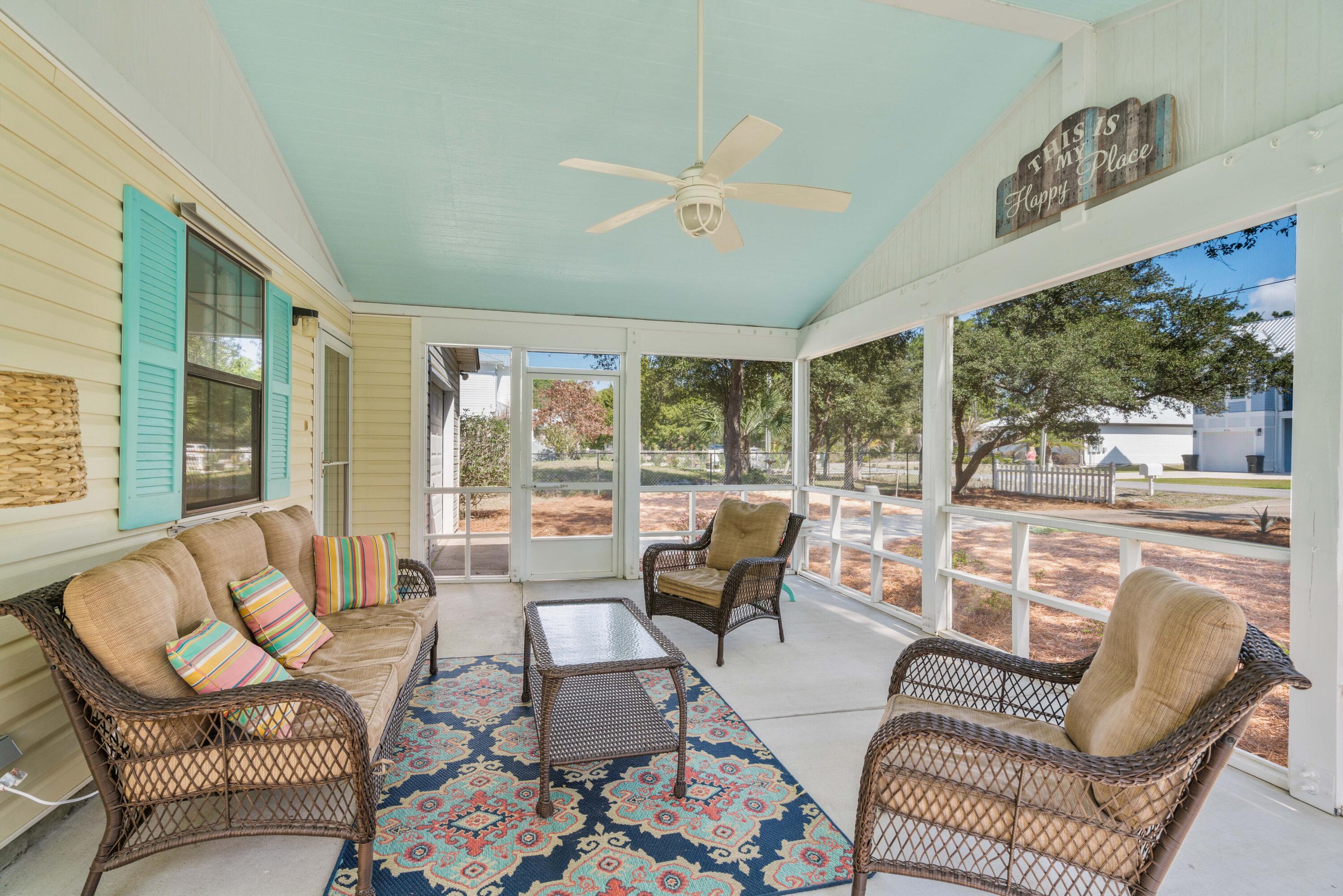 465 Seacrest Drive Inlet Beach, FL 32461 - Photo 15 of 47 a living room with furniture and a floor to ceiling window