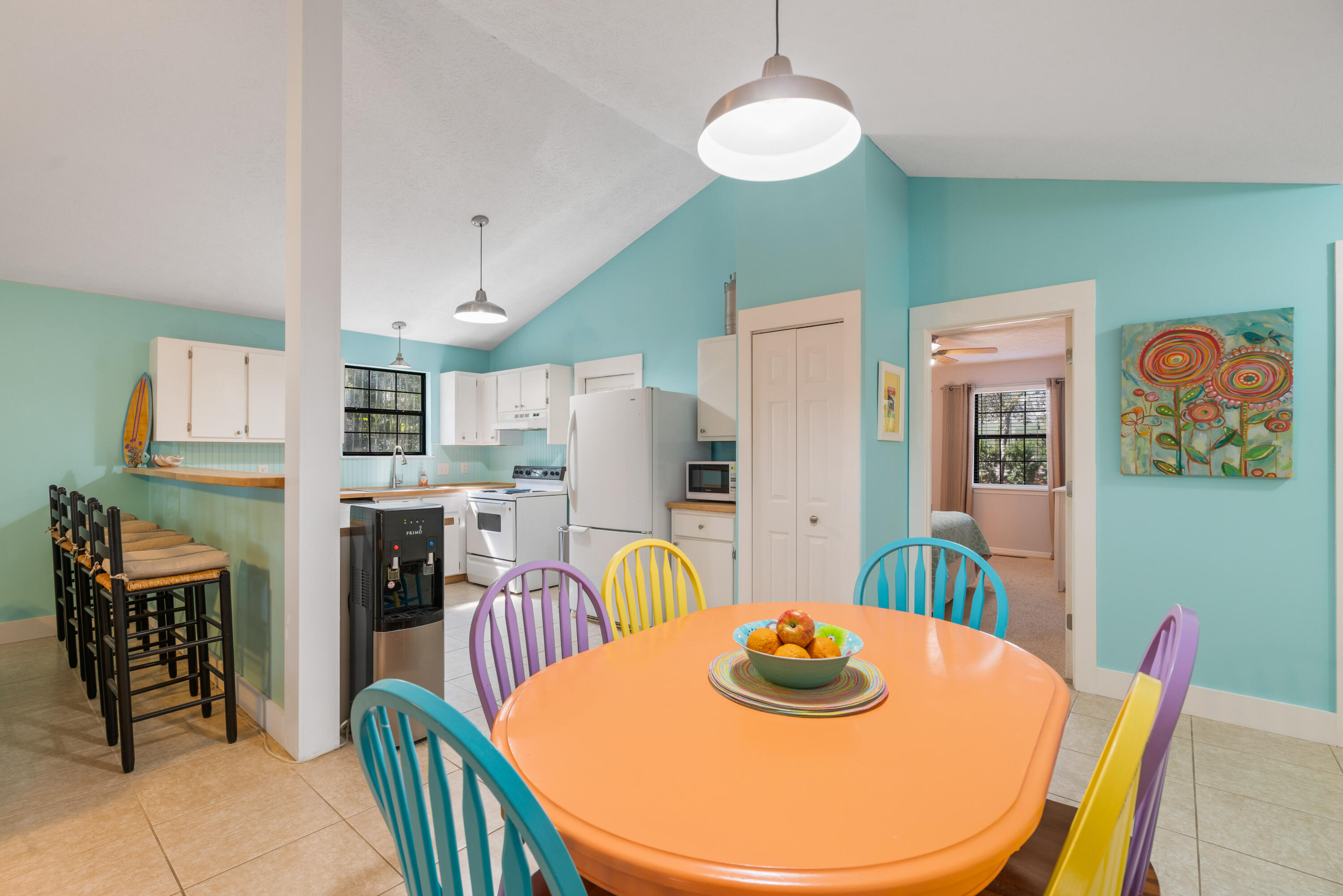 465 Seacrest Drive Inlet Beach, FL 32461 - Photo 21 of 47 a dining room with stainless steel appliances kitchen island granite countertop a dining table and chairs
