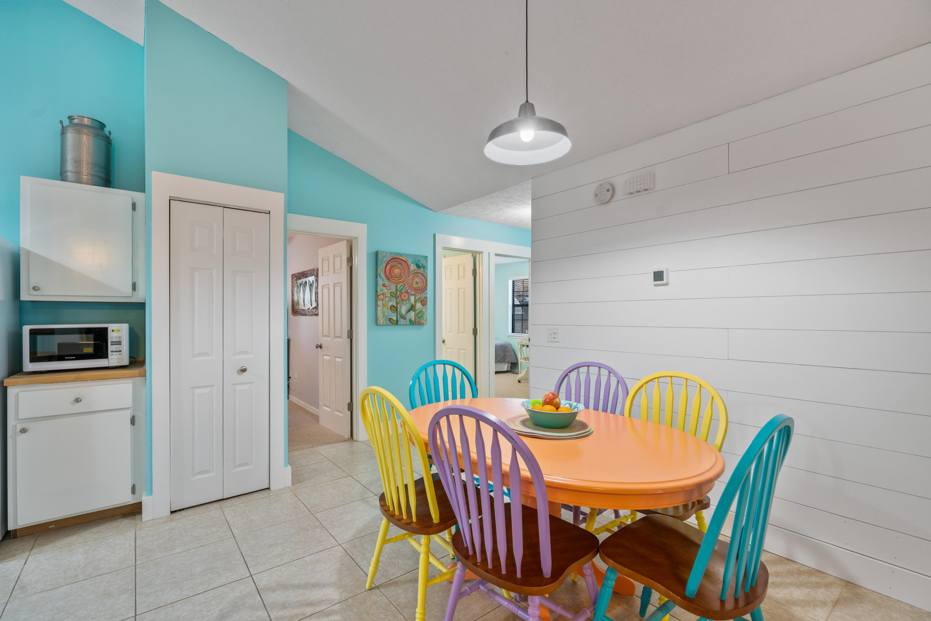 465 Seacrest Drive Inlet Beach, FL 32461 - Photo 22 of 47 a view of a dining room with furniture and chandelier