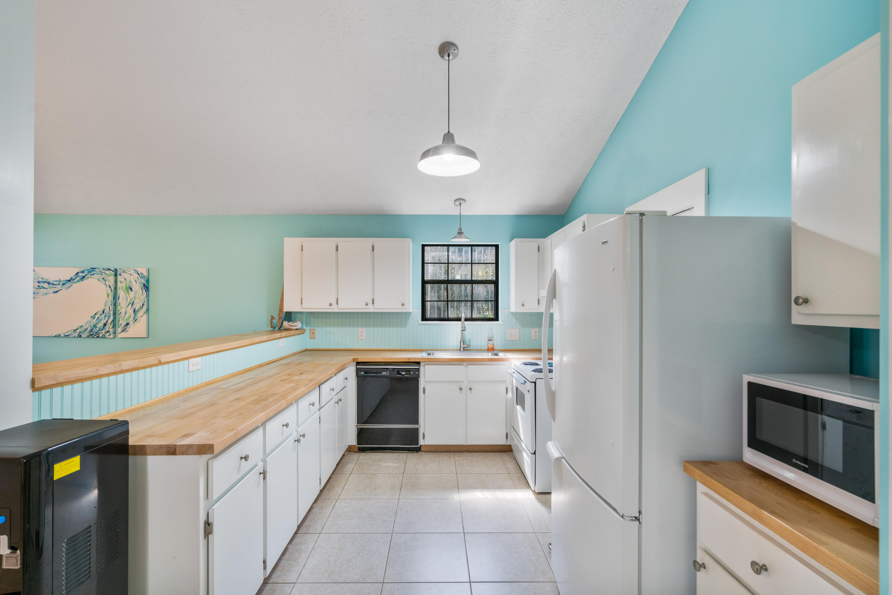 465 Seacrest Drive Inlet Beach, FL 32461 - Photo 24 of 47 a kitchen with a refrigerator a sink and dishwasher