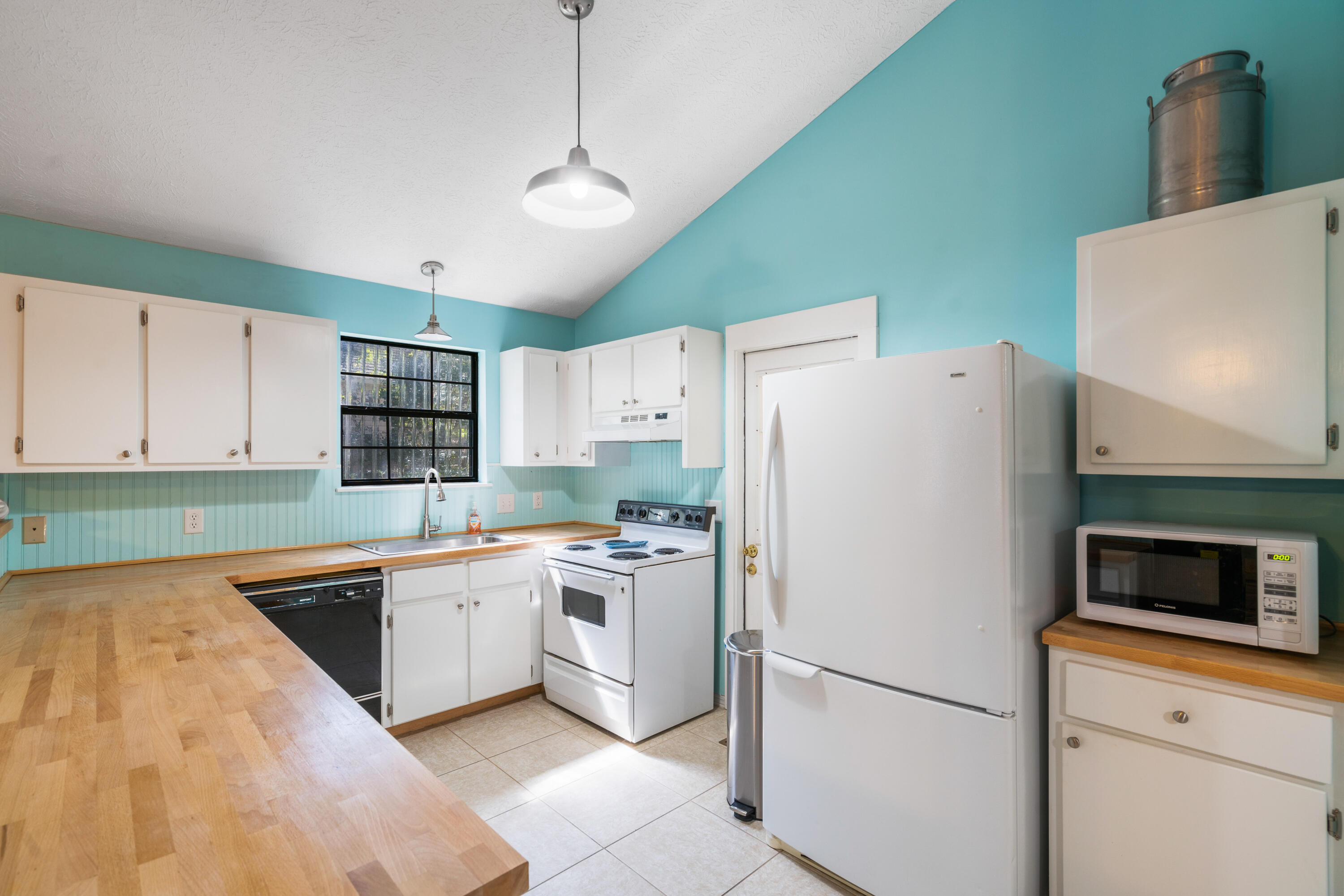465 Seacrest Drive Inlet Beach, FL 32461 - Photo 25 of 47 a kitchen with a sink a stove and refrigerator