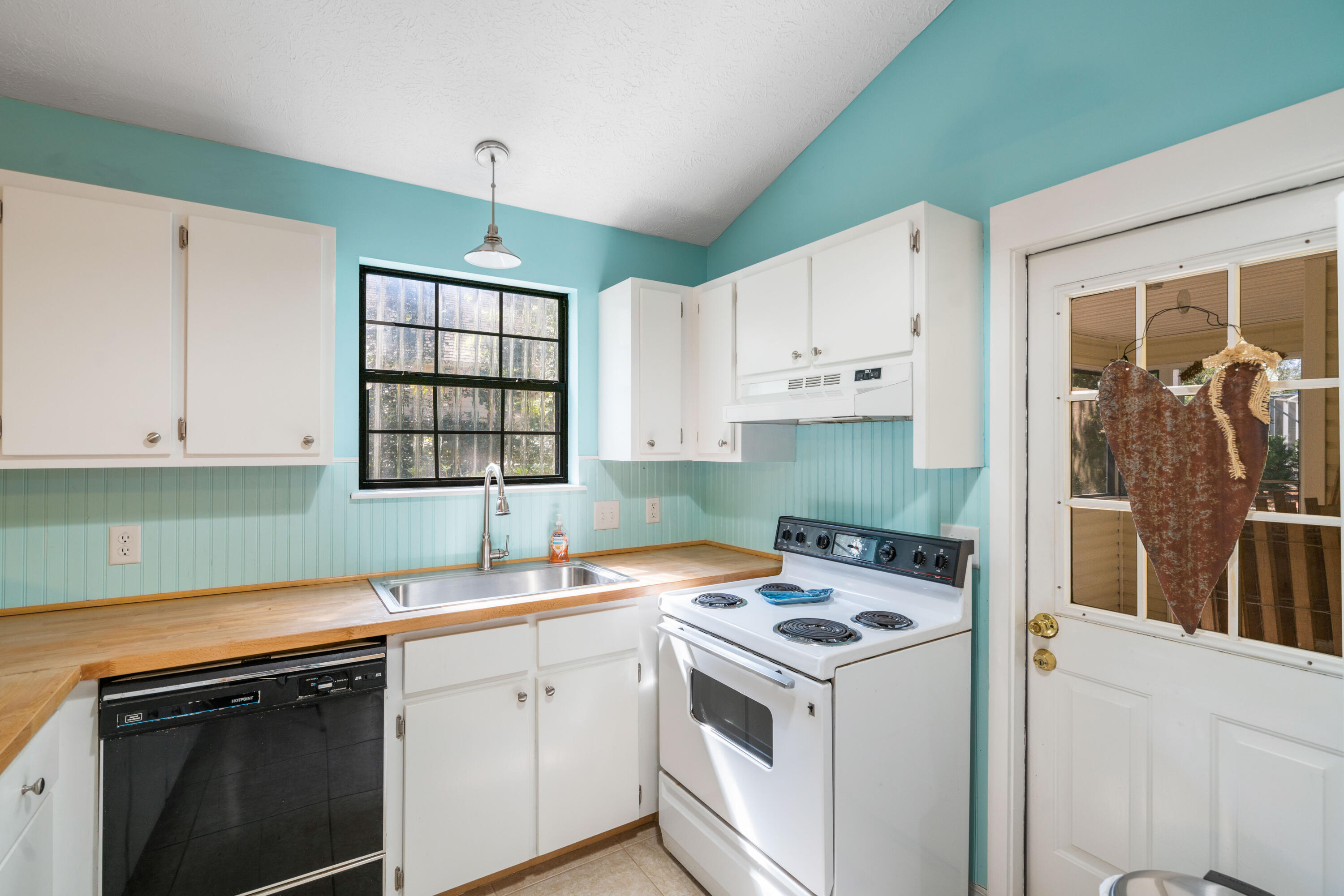 465 Seacrest Drive Inlet Beach, FL 32461 - Photo 26 of 47 a view of a kitchen with sink and cabinets
