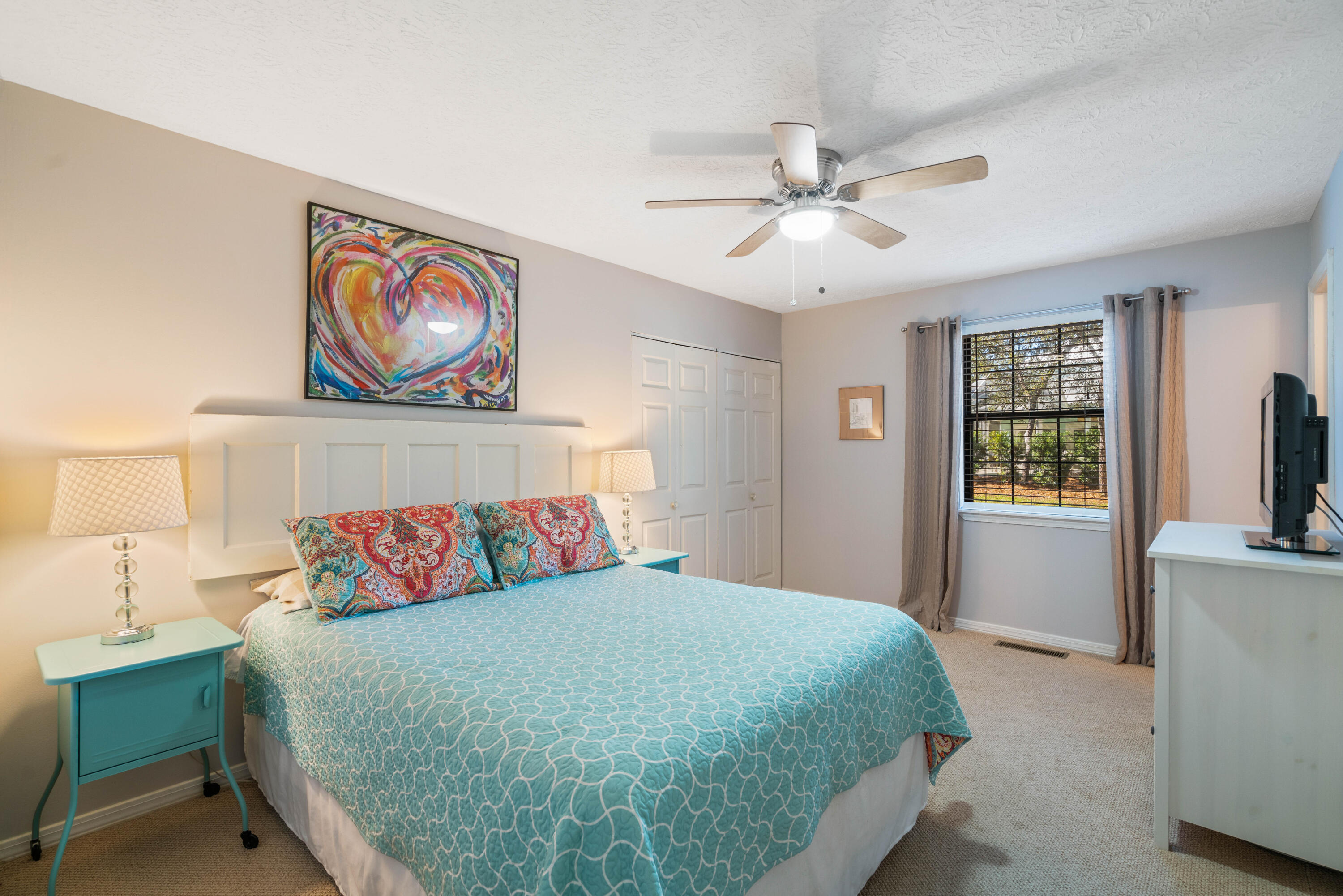 465 Seacrest Drive Inlet Beach, FL 32461 - Photo 27 of 47 a bedroom with a bed and a chandelier