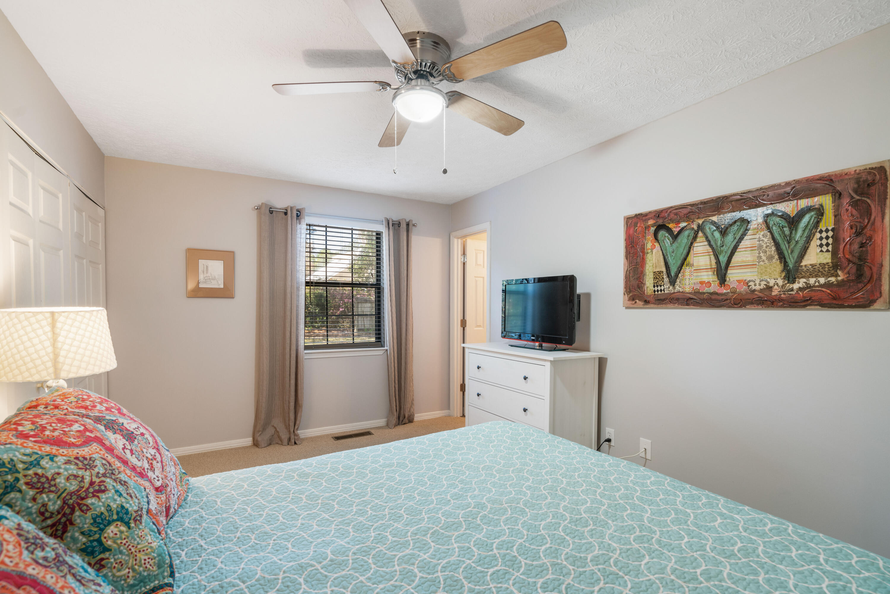 465 Seacrest Drive Inlet Beach, FL 32461 - Photo 28 of 47 a bedroom with a large bed and a flat screen tv