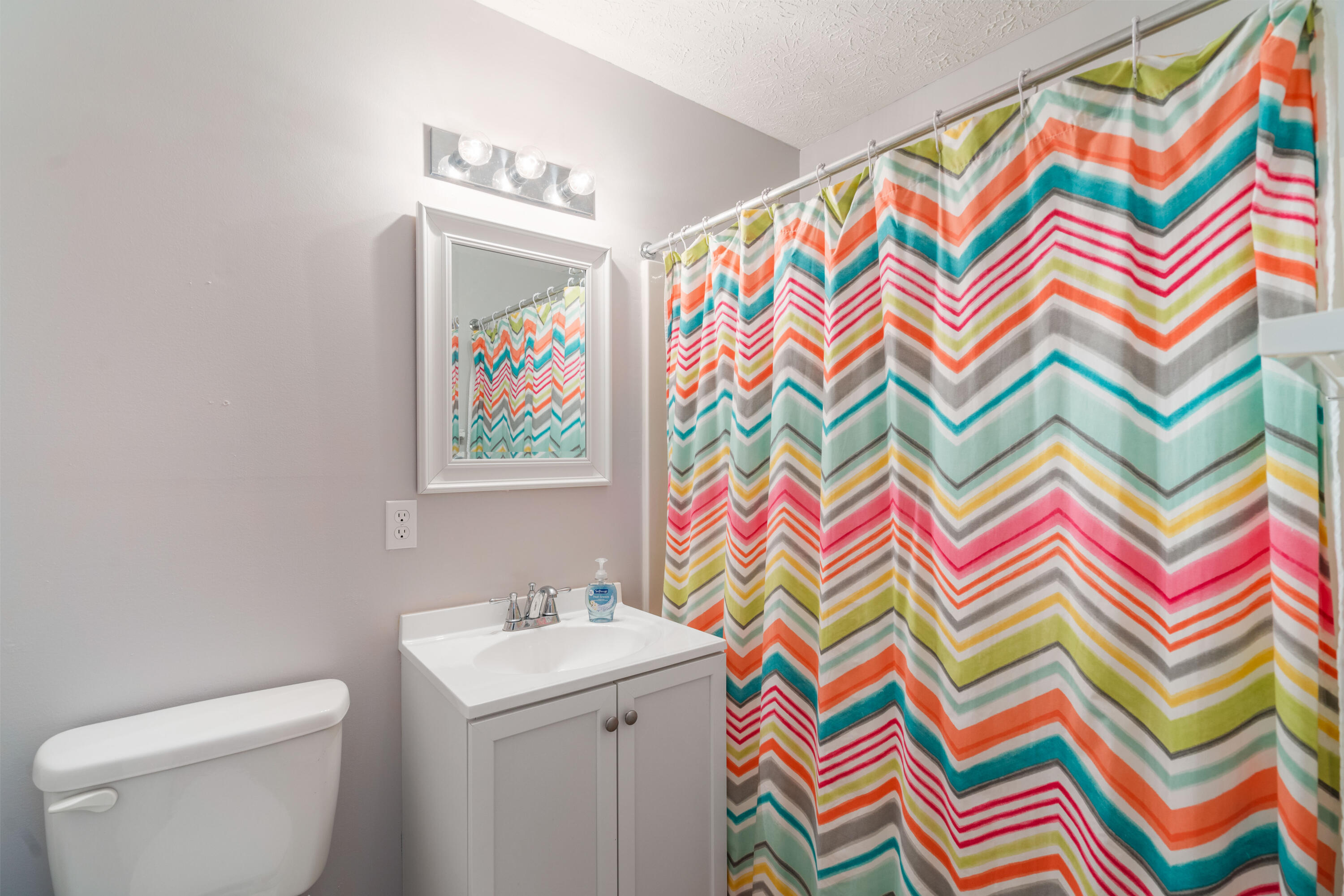 465 Seacrest Drive Inlet Beach, FL 32461 - Photo 30 of 47 a bathroom with a sink a vanity and a painting on the wall
