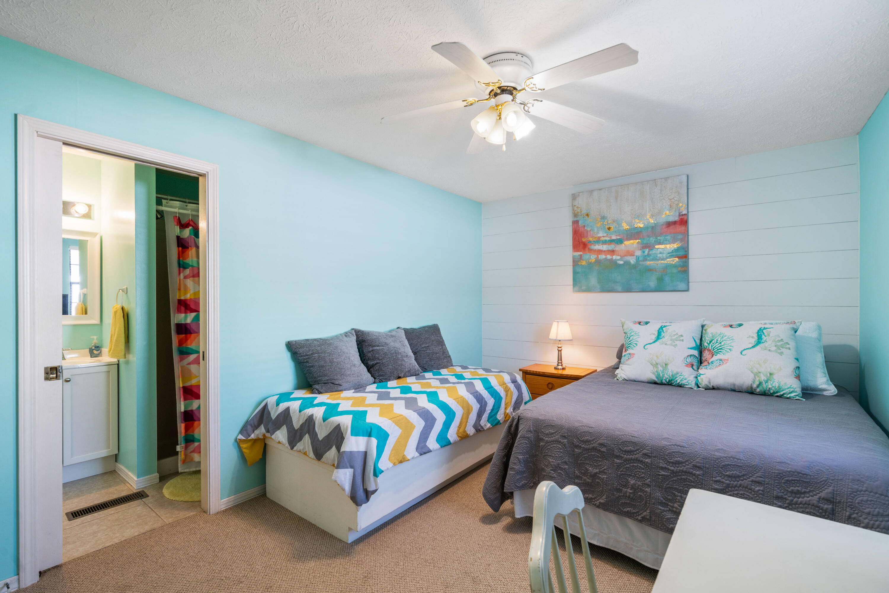 465 Seacrest Drive Inlet Beach, FL 32461 - Photo 34 of 47 a bedroom with a bed and a chandelier