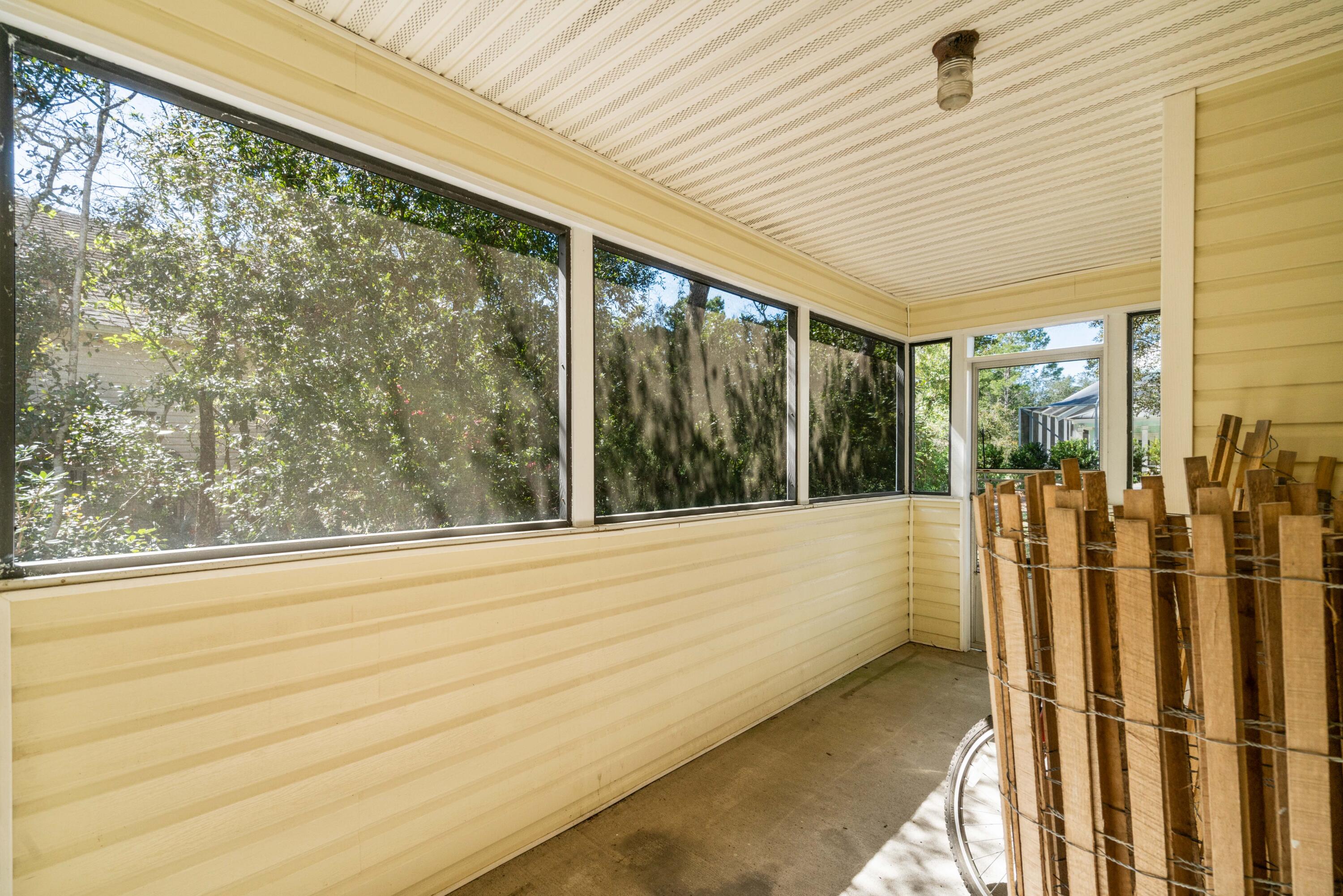 465 Seacrest Drive Inlet Beach, FL 32461 - Photo 37 of 47 a view of a porch with wooden floor and outdoor space
