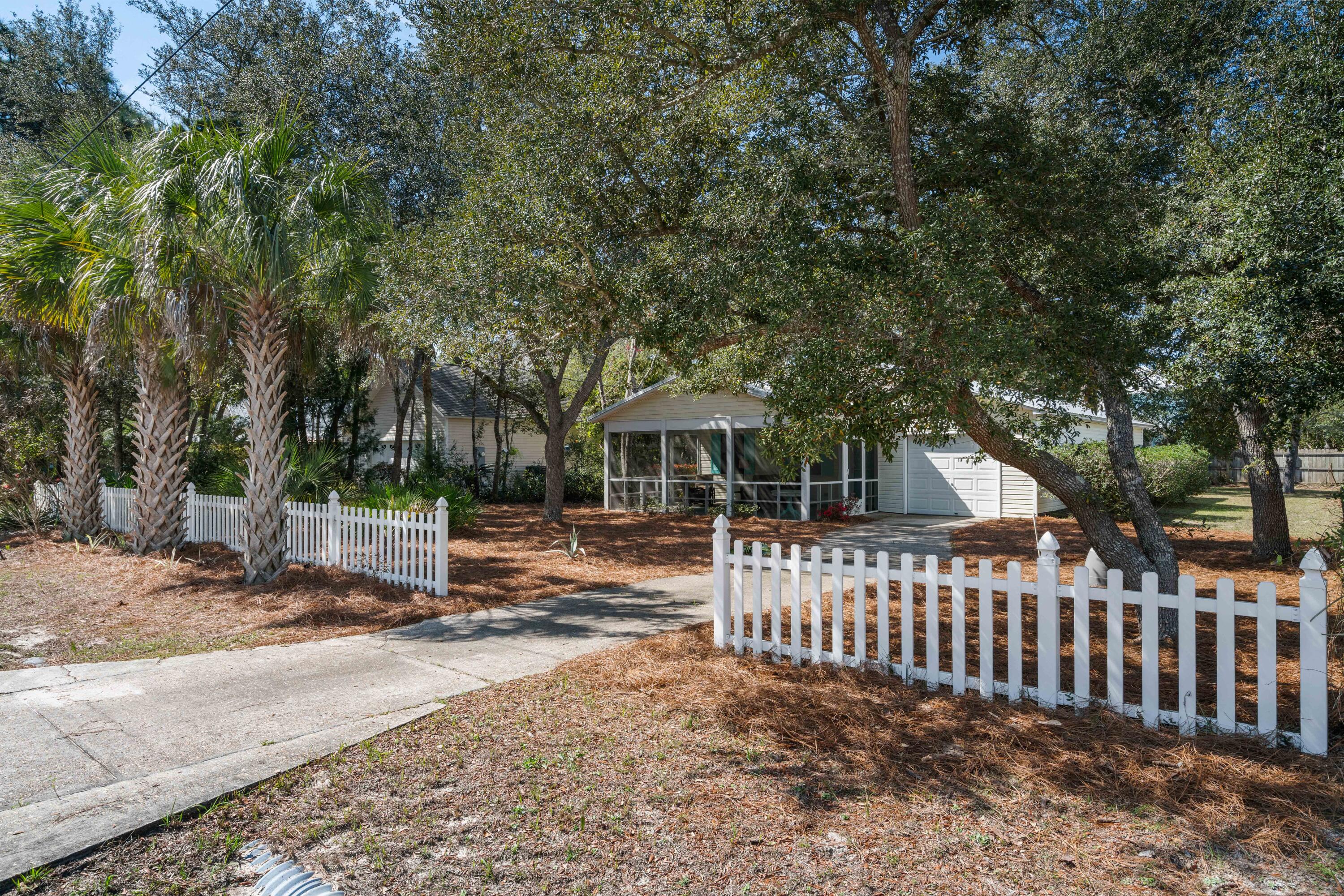 465 Seacrest Drive Inlet Beach, FL 32461 - Photo 6 of 47 a front view of a house with a bench
