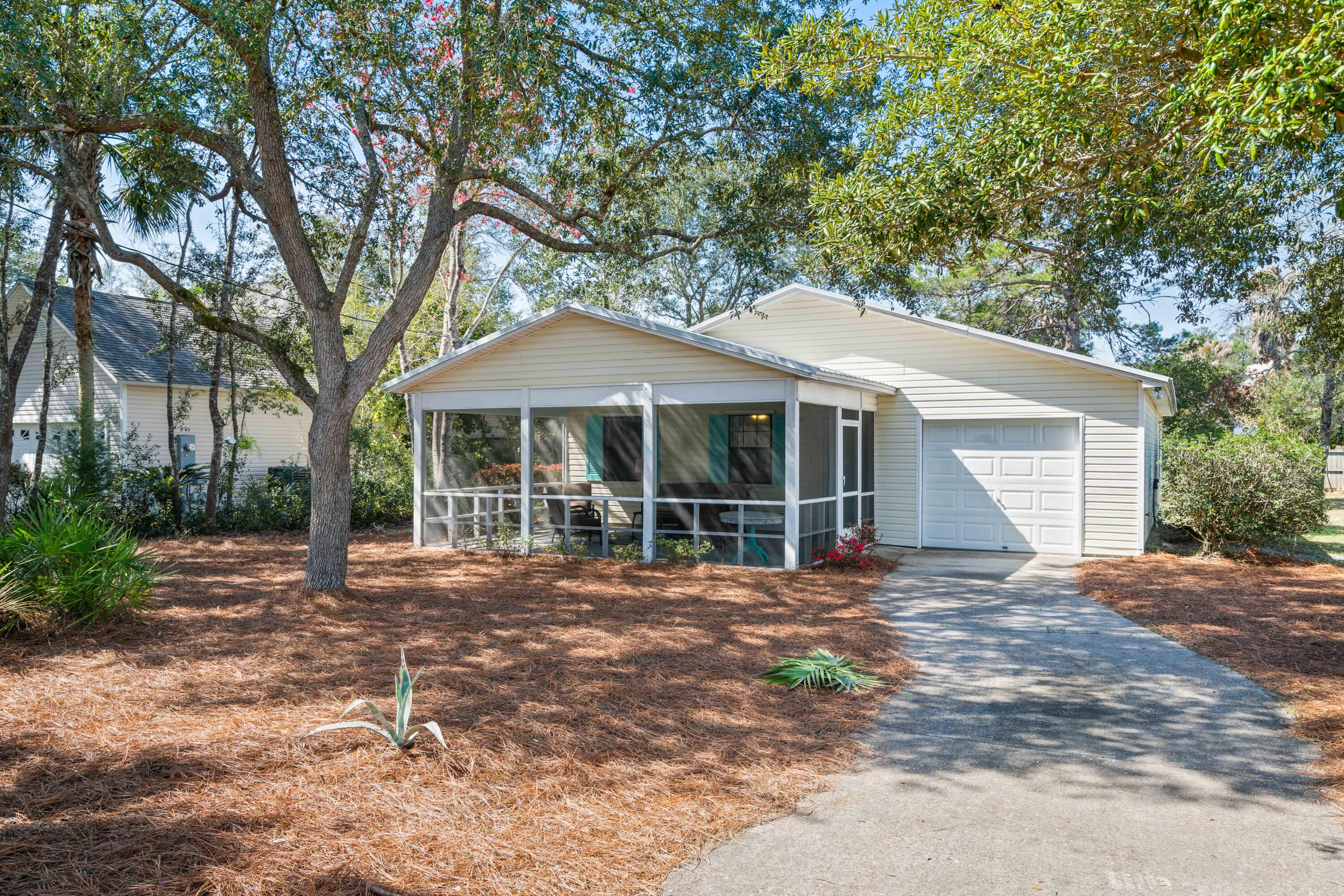 465 Seacrest Drive Inlet Beach, FL 32461 - Photo 8 of 47 a front view of a house with a garden