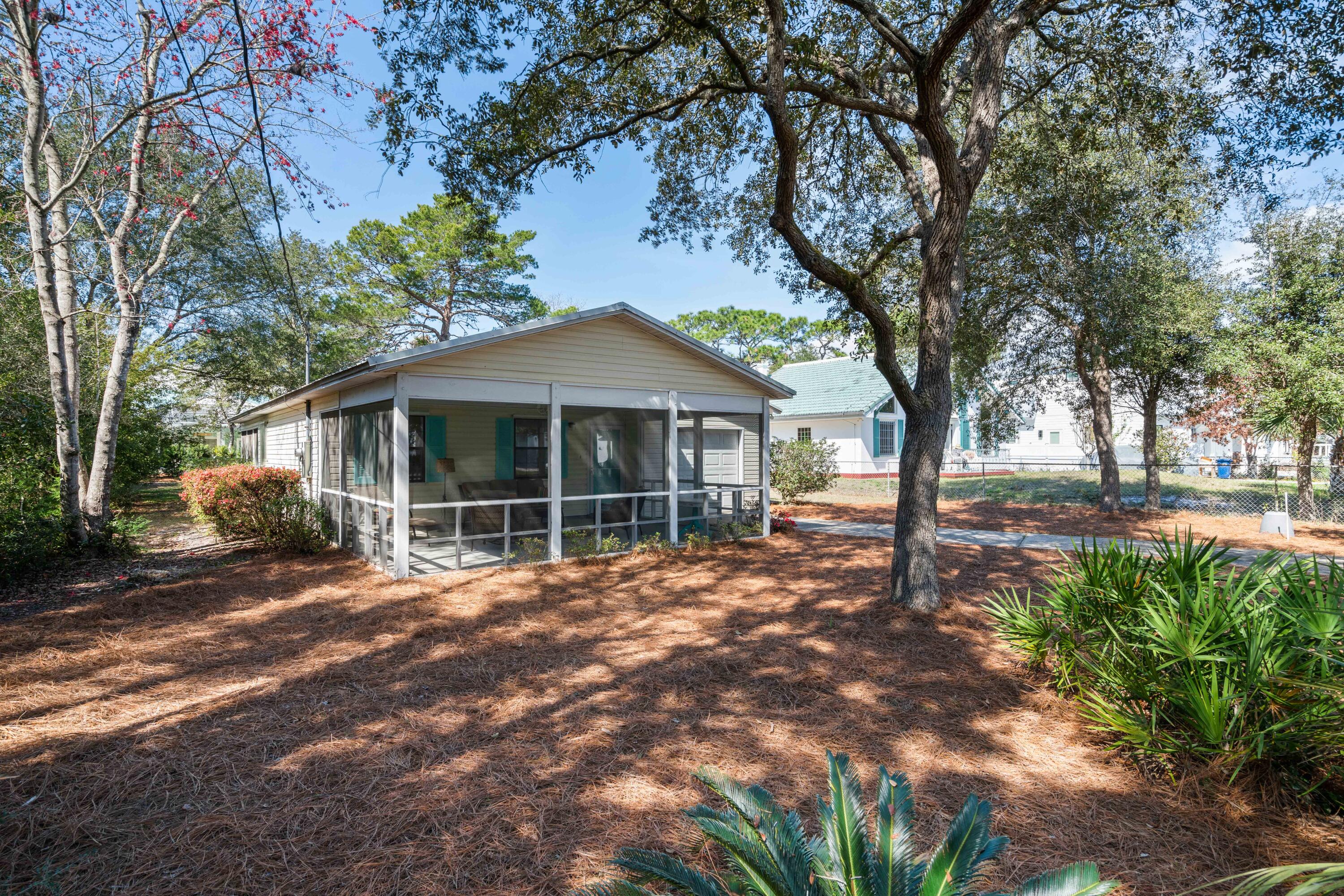465 Seacrest Drive Inlet Beach, FL 32461 - Photo 9 of 47 a view of a house with a tree in the yard