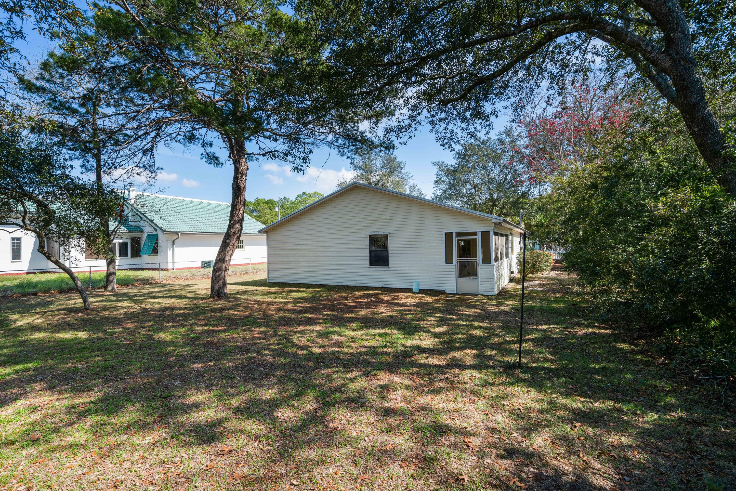 465 Seacrest Drive Inlet Beach, FL 32461 - Photo 10 of 47 a house covered with tall trees