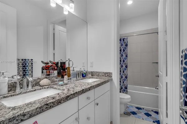 a bathroom with a toilet and a bathtub