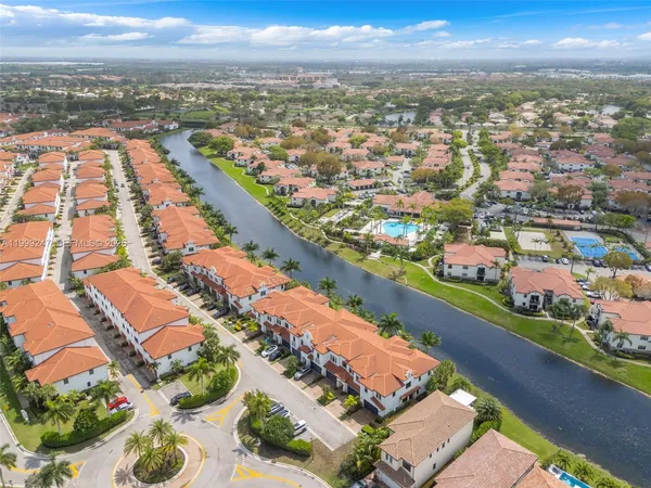 an aerial view of residential houses with outdoor space