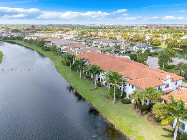 an aerial view of residential houses with outdoor space