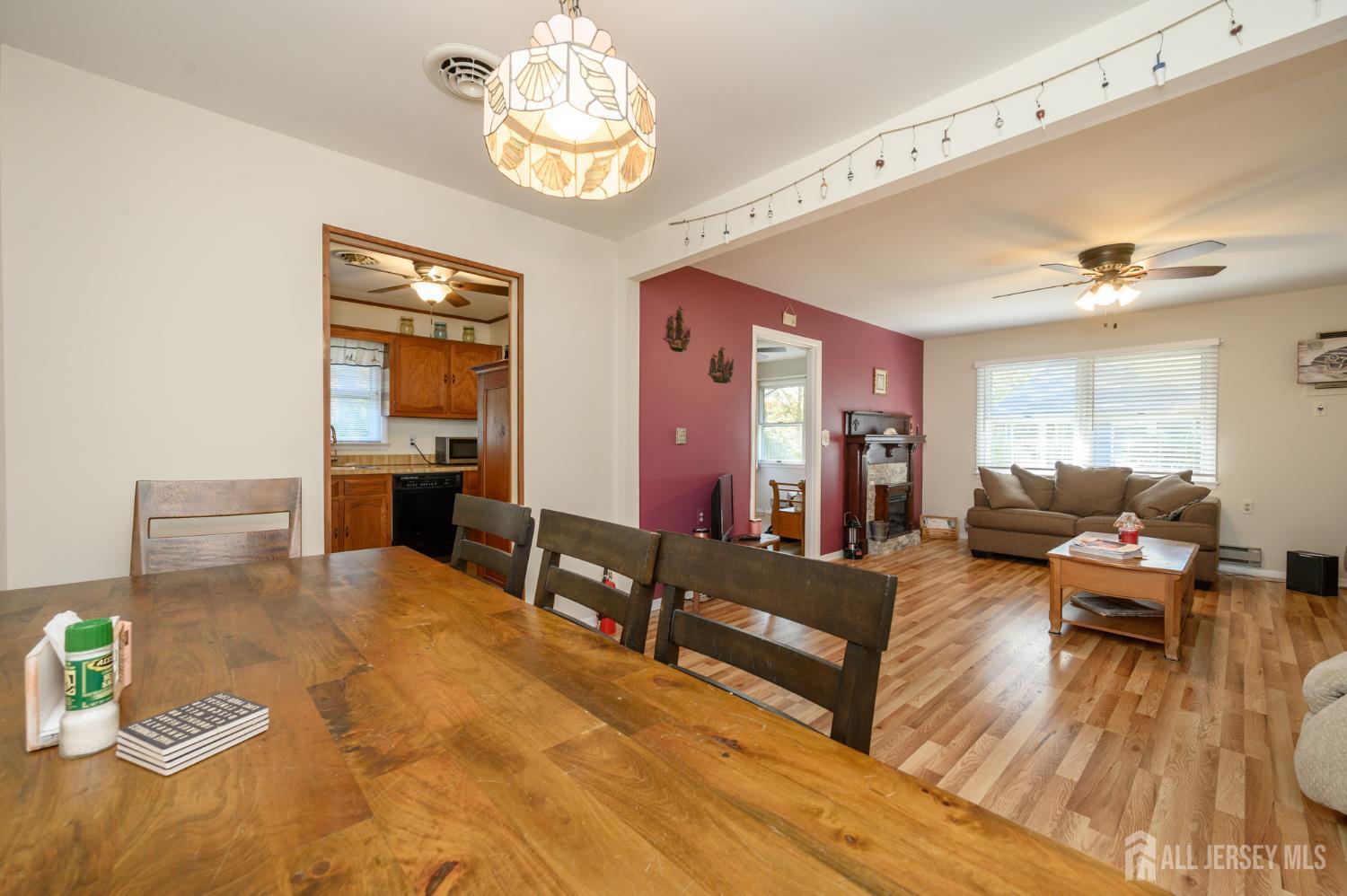 38 Cranberry Road Manahawkin, NJ 08050 - Photo 12 of 23 a living room with fireplace furniture and a wooden floor
