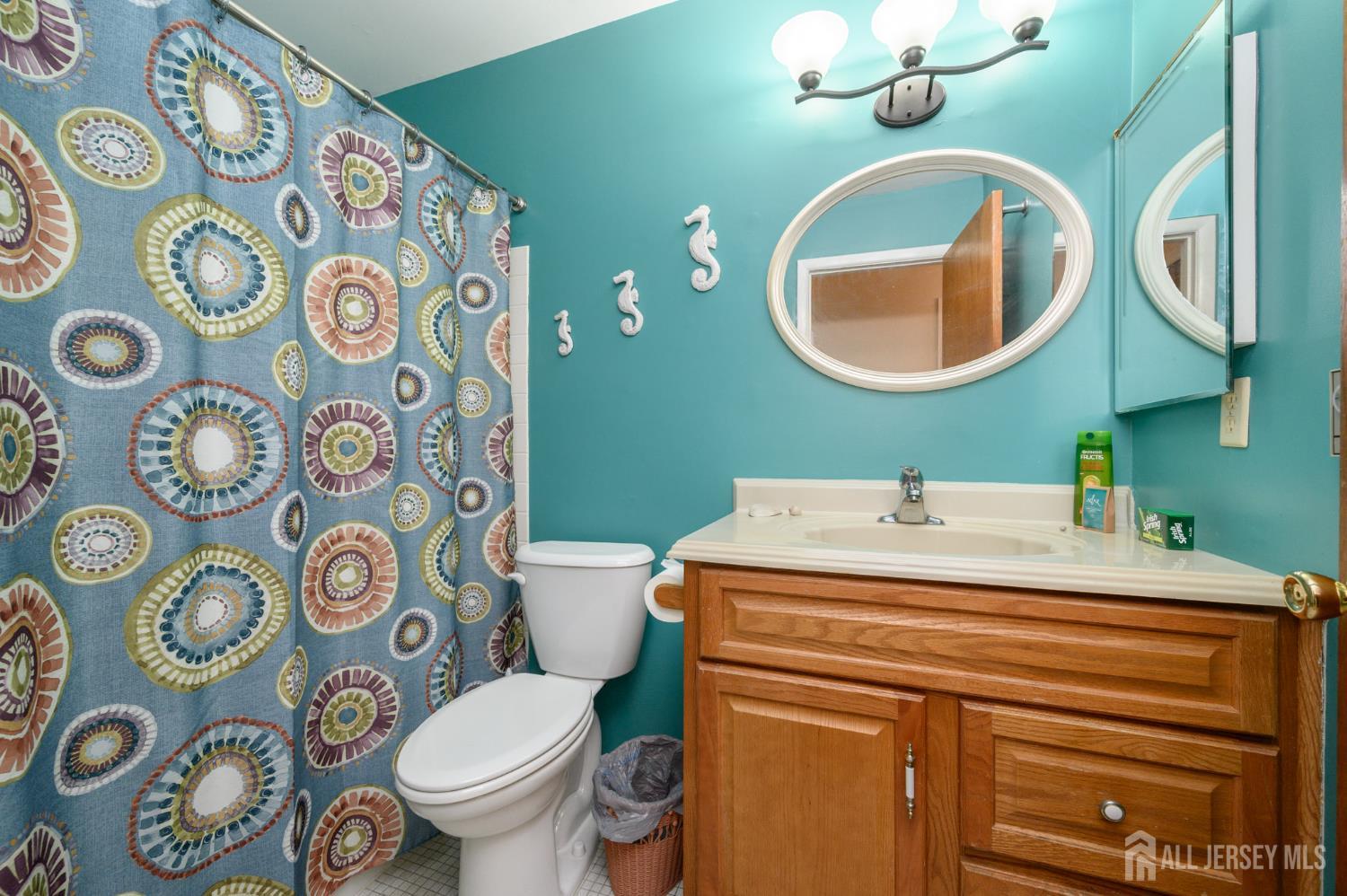 38 Cranberry Road Manahawkin, NJ 08050 - Photo 18 of 23 a bathroom with a toilet and a sink