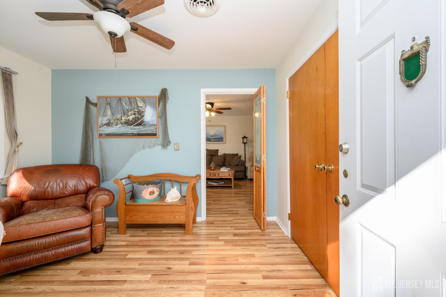38 Cranberry Road Manahawkin, NJ 08050 - Photo 3 of 23 a living room with furniture and a wooden floor