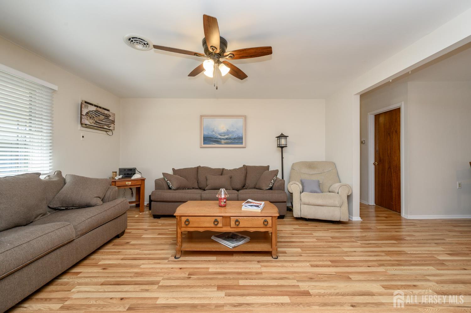 38 Cranberry Road Manahawkin, NJ 08050 - Photo 8 of 23 a living room with furniture and a view of kitchen