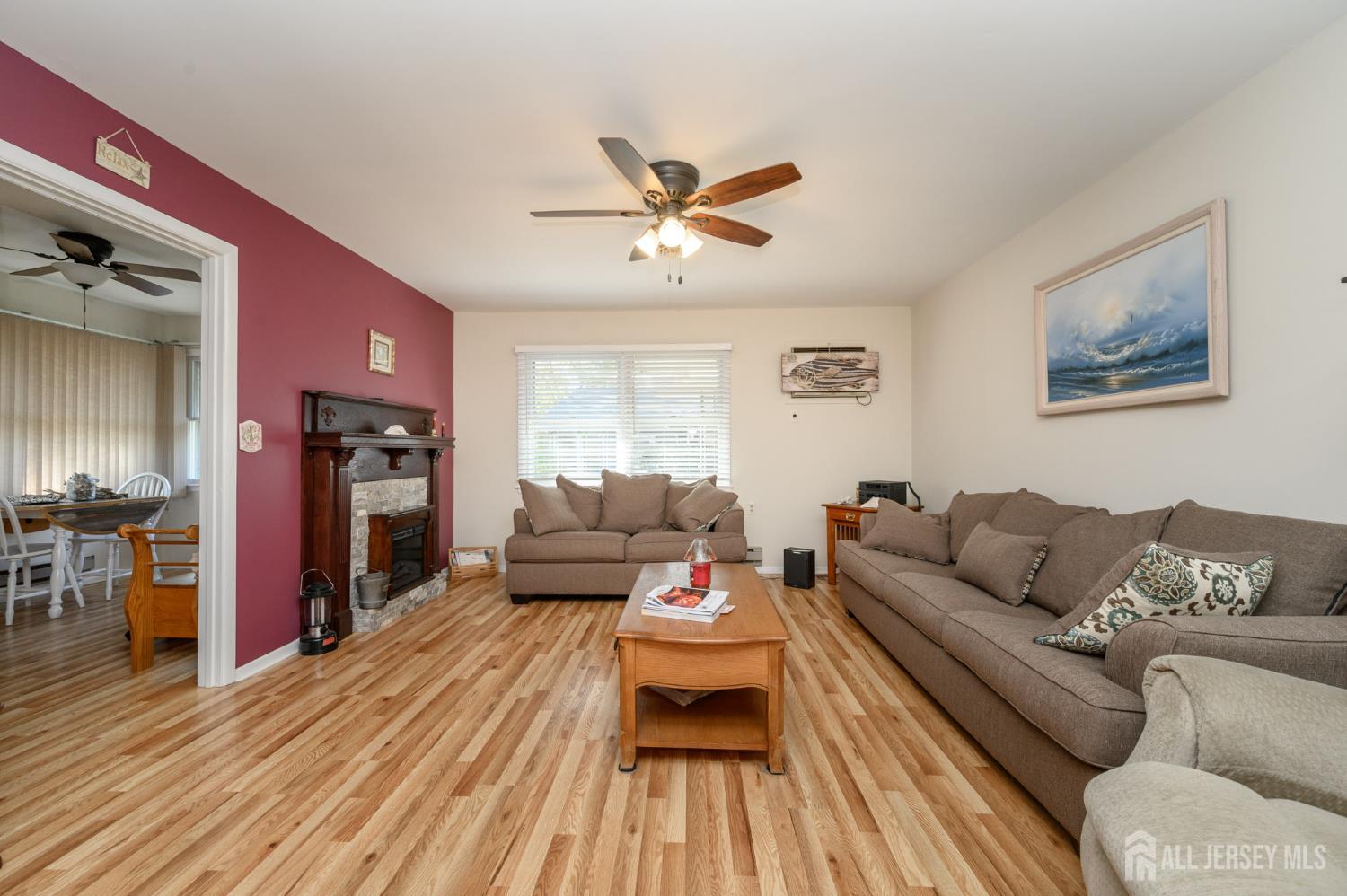 38 Cranberry Road Manahawkin, NJ 08050 - Photo 9 of 23 a living room with furniture and wooden floor