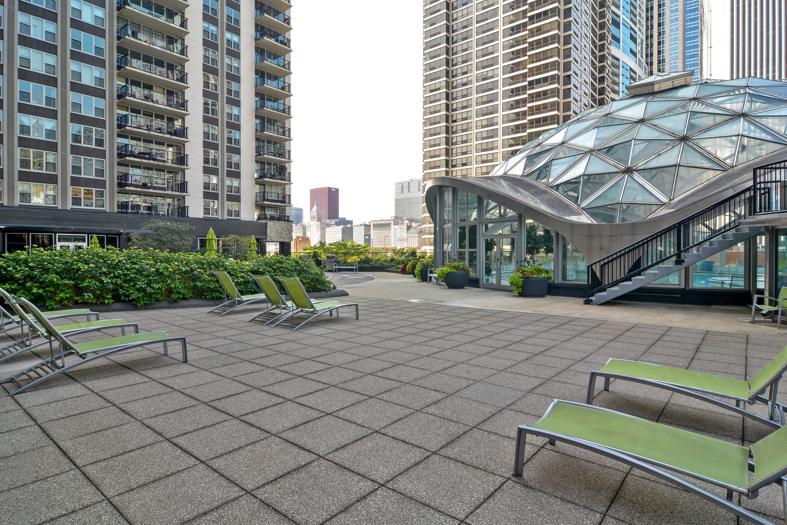 400 East Randolph Street, Unit 3326 Chicago, IL 60601 - Photo 19 of 19 a view of a patio with couches and a table and chairs