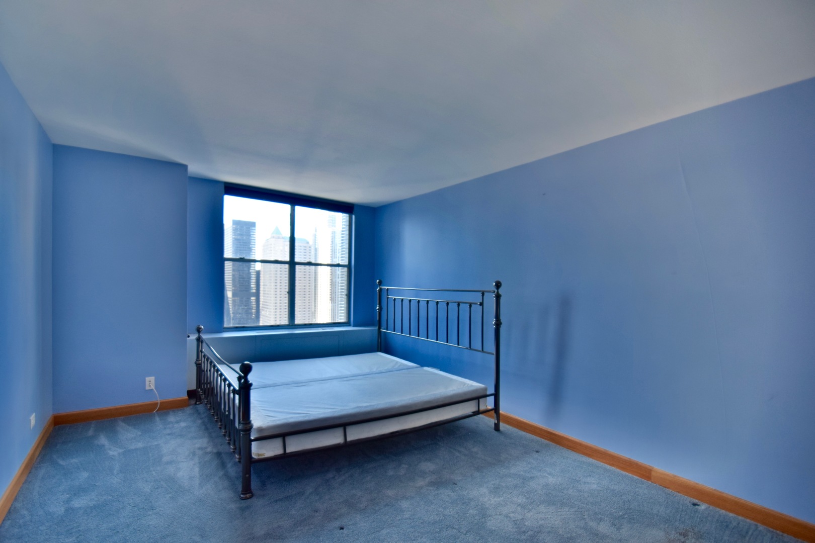 400 East Randolph Street, Unit 3326 Chicago, IL 60601 - Photo 7 of 19 a bedroom with a bed and window