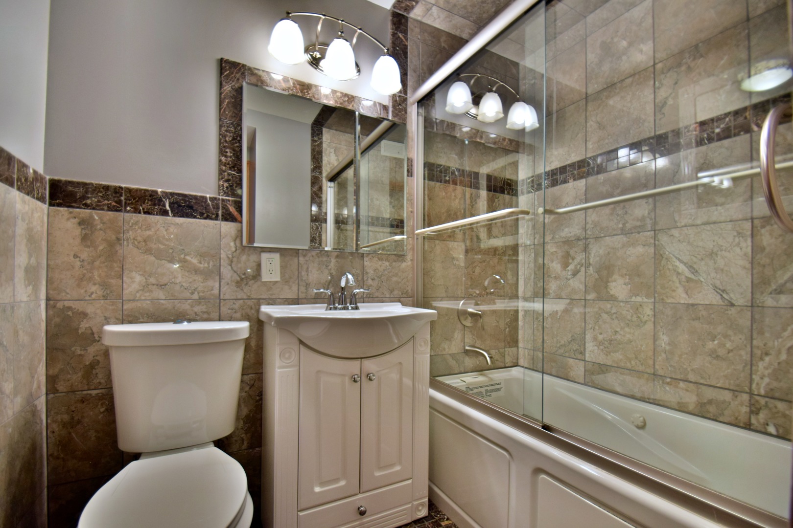 400 East Randolph Street, Unit 3326 Chicago, IL 60601 - Photo 9 of 19 a bathroom with a sink a toilet and shower