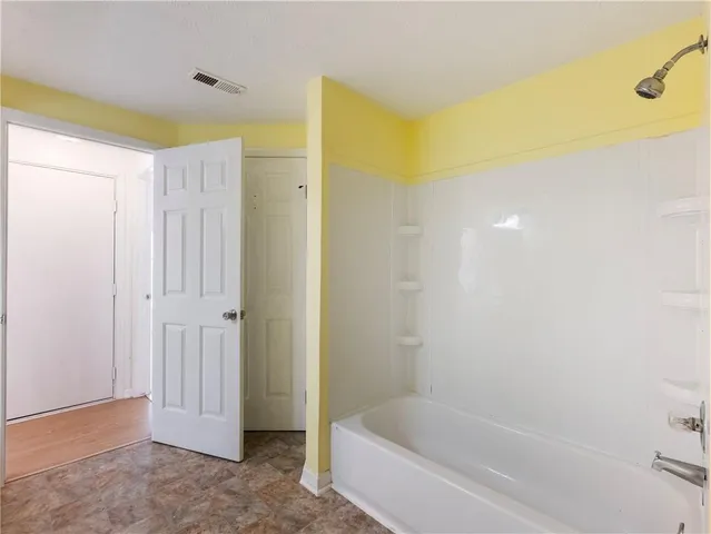 a bathroom with a bathtub