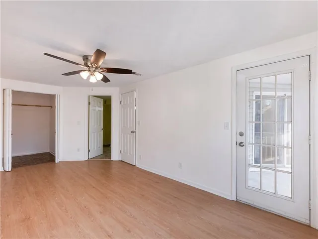 a view of a livingroom with a chandelier fan