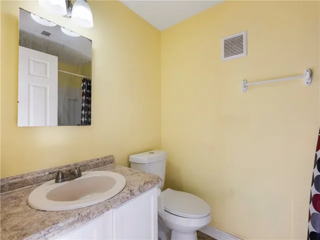 a bathroom with a sink and a toilet