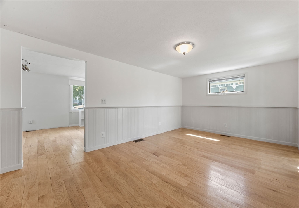 7 Grove Street Wareham, MA 02558 - Photo 17 of 41 an empty room with wooden floor and windows