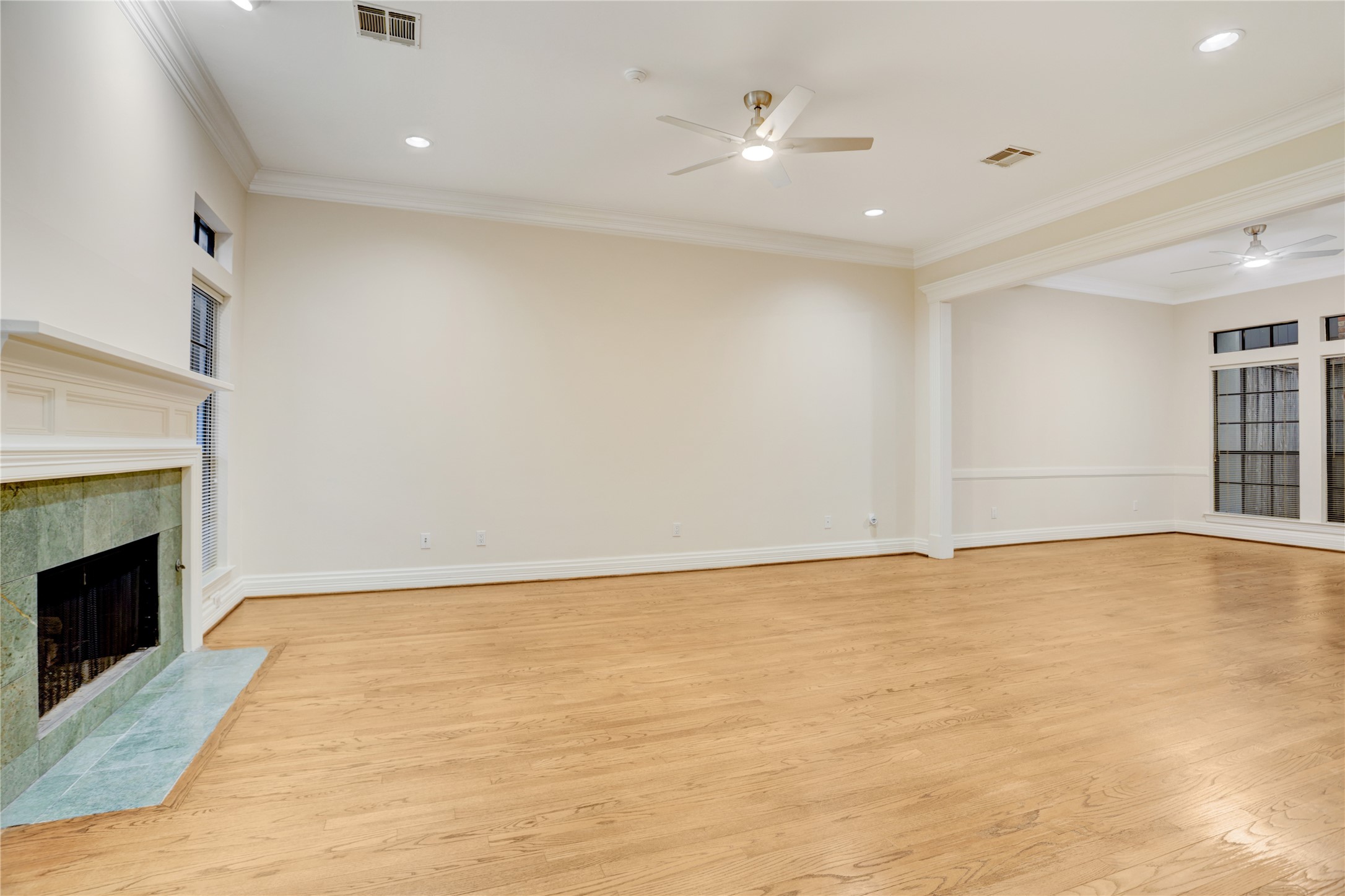 2004 Nantucket Drive, Unit C Houston, TX 77057 - Photo 4 of 40 Living Room with Hardwood Floors, Gas Fireplace, New Lighting Fixtures And Recently Refreshed Paint
