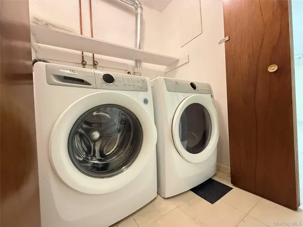 a utility room with dryer and washer