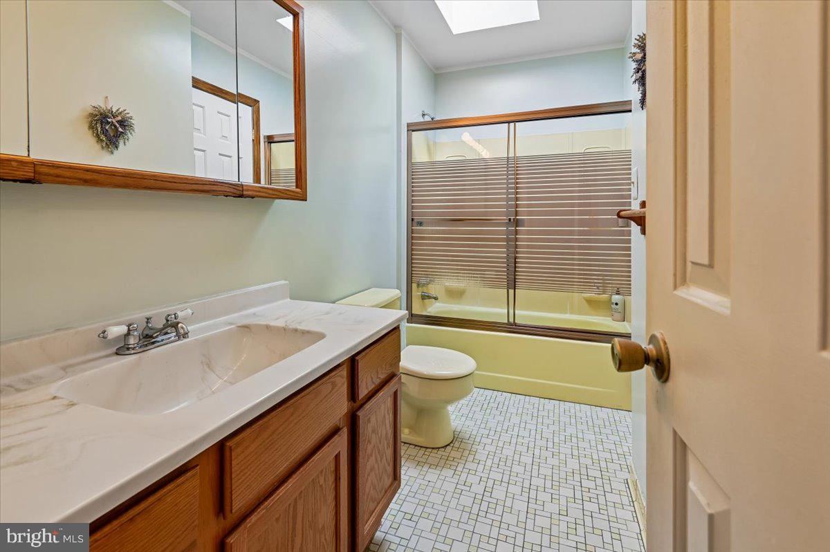 705 Marshall Manor Drive Silver Spring, MD 20905 - Photo 21 of 54 a bathroom with a sink a toilet and shower
