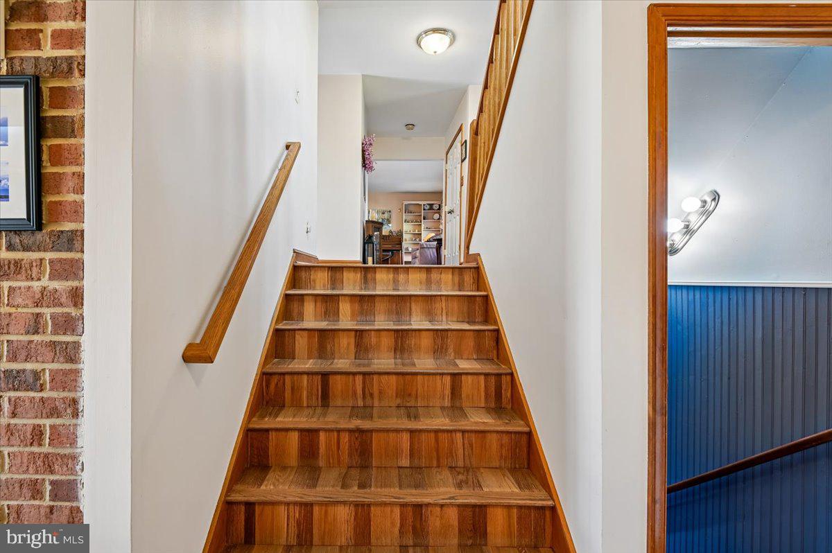 705 Marshall Manor Drive Silver Spring, MD 20905 - Photo 30 of 54 a view of staircase with white walls and a window