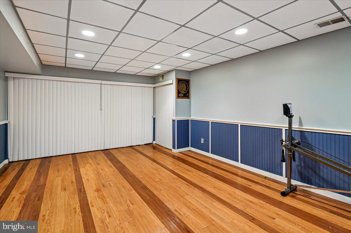 705 Marshall Manor Drive Silver Spring, MD 20905 - Photo 41 of 54 a room with a wooden floor