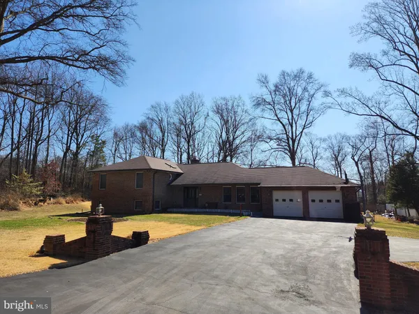 a view of swimming pool with outdoor seating and yard