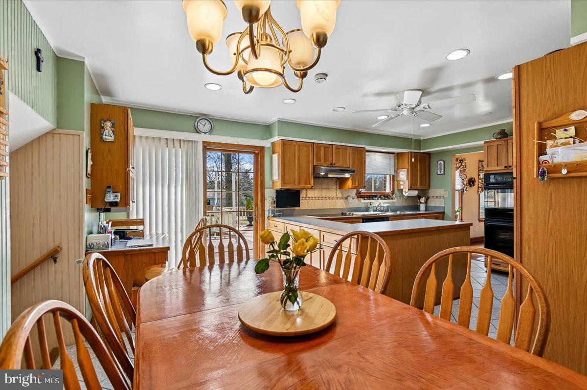 705 Marshall Manor Drive Silver Spring, MD 20905 - Photo 8 of 54 a dining room with furniture a rug and a chandelier