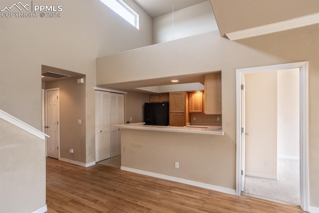 6967 Stetson Ranch Point, Unit 204 Colorado Springs, CO 80922 - Photo 11 of 19 wooden floor in an empty room