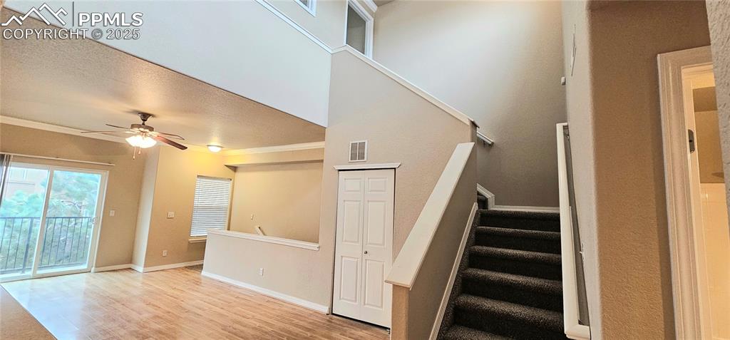 6967 Stetson Ranch Point, Unit 204 Colorado Springs, CO 80922 - Photo 14 of 19 a view of entryway with wooden floor and stair