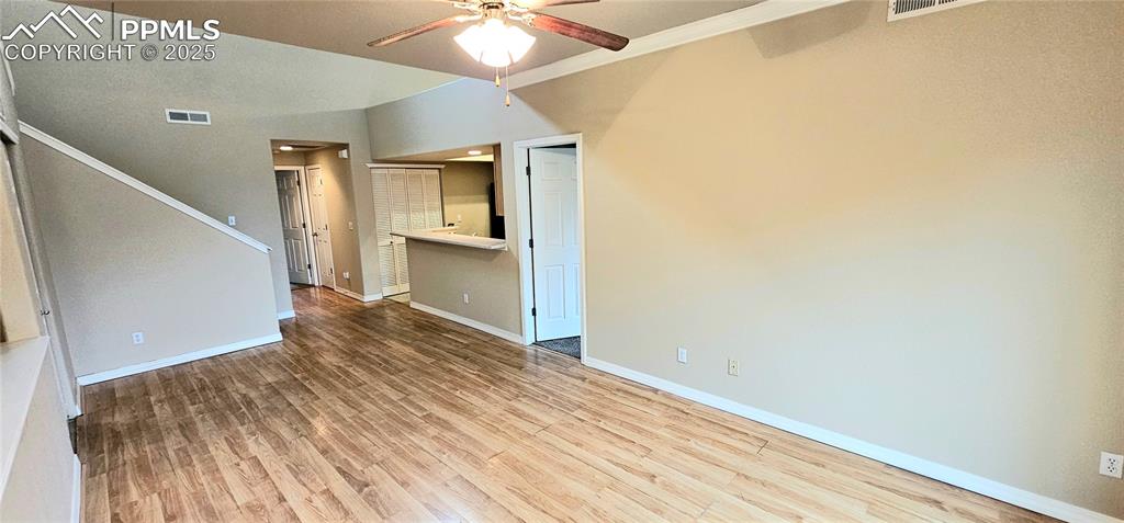 6967 Stetson Ranch Point, Unit 204 Colorado Springs, CO 80922 - Photo 15 of 19 a view of a room with wooden floor and staircase