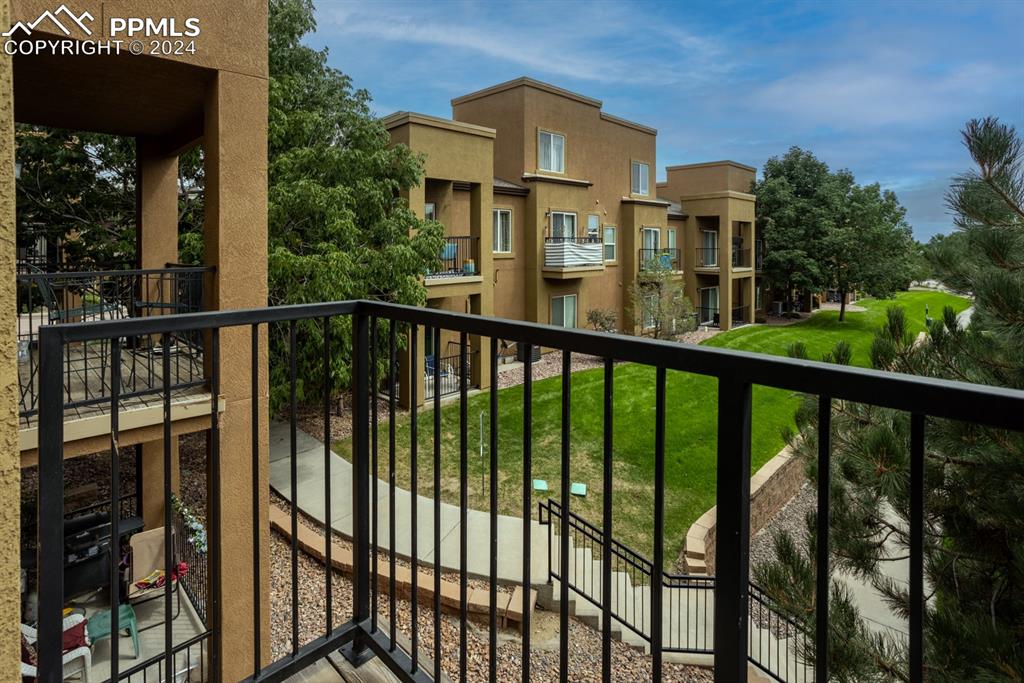 6967 Stetson Ranch Point, Unit 204 Colorado Springs, CO 80922 - Photo 4 of 19 a view of a city from a balcony