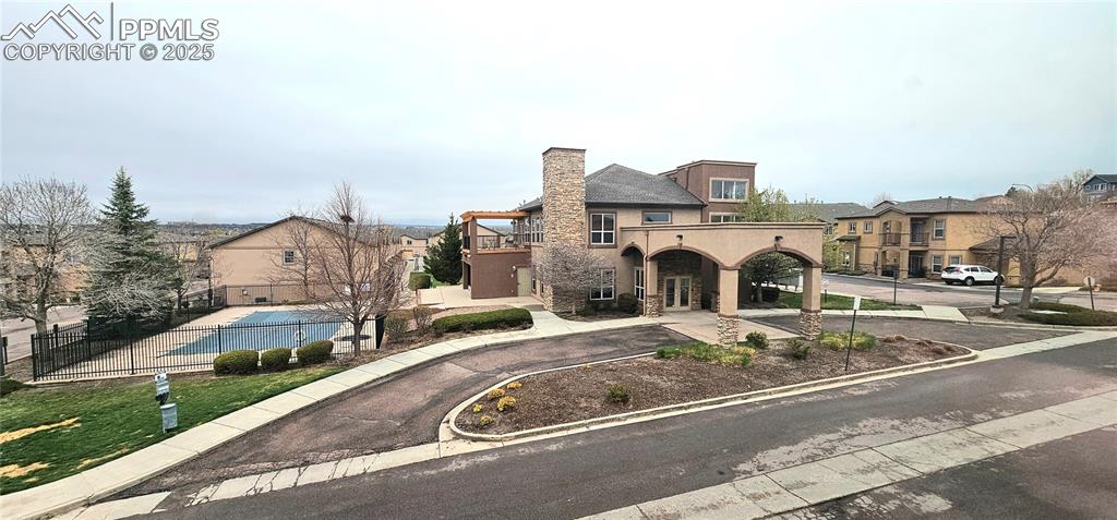 6967 Stetson Ranch Point, Unit 204 Colorado Springs, CO 80922 - Photo 7 of 19 a view of a house with a outdoor space