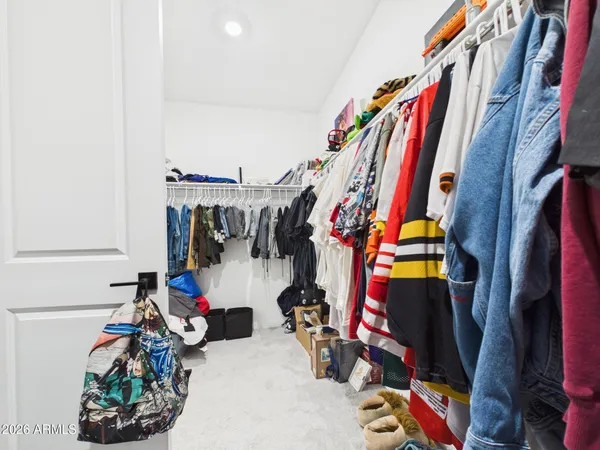 a bathroom with a double vanity sink toilet mirror and bathtub