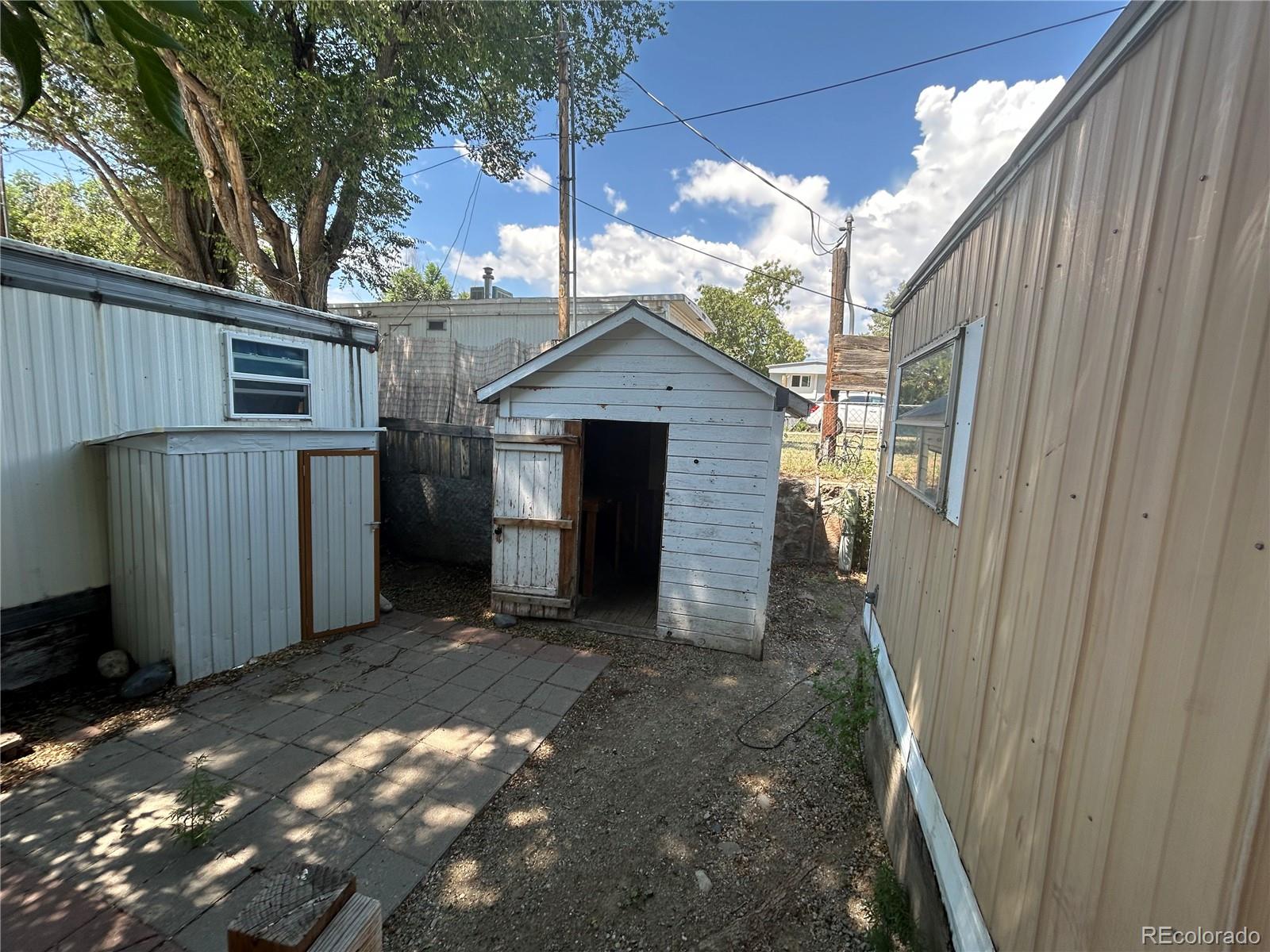 226 Scott Street Salida, CO 81201 - Photo 12 of 15 a view of a house with a door and wooden walls